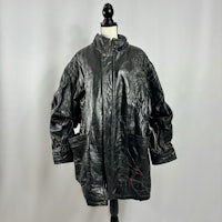 a black leather jacket on a mannequin